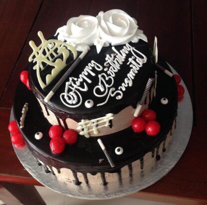 Two tier chocolate with cherry topping